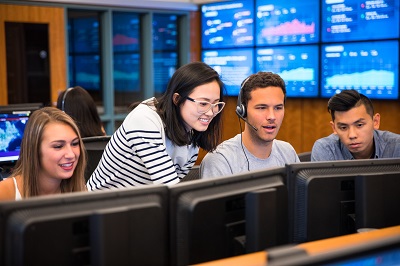 Students with professor in the Trading Room